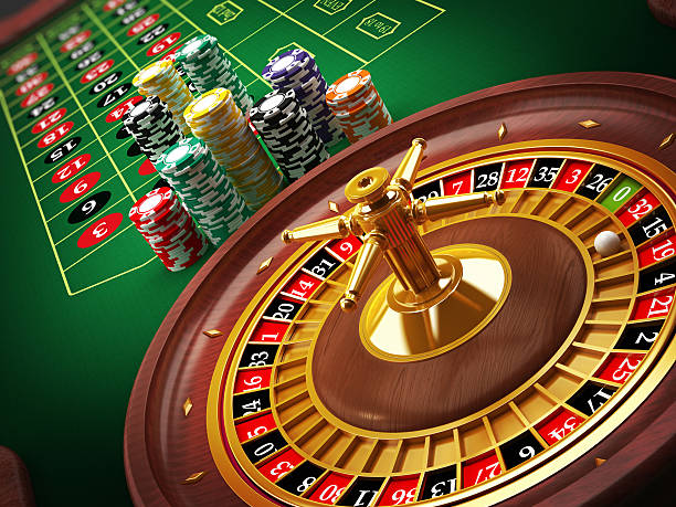 Roulette wheel and casino chips on the table.Similar images: